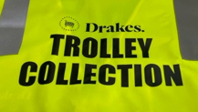 Heatpress DRAKES TROLLEY COLLECTION Logo Back CentreVestsBLACK Logo3 Lines of Text